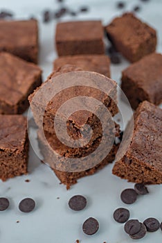 Chocolate frosted brownies on a ceramic plate