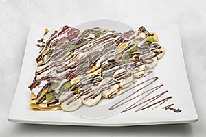 Chocolate & fruits crepe isolated on white background
