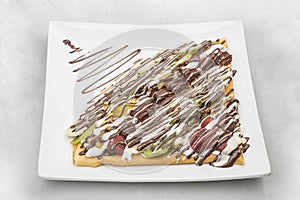 Chocolate & fruits crepe isolated on white background