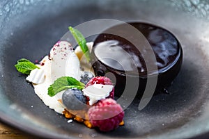 Chocolate fudge mousse cake with ice cream,berries