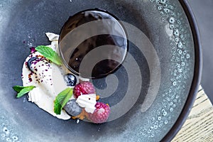 Chocolate fudge mousse cake with ice cream,berries