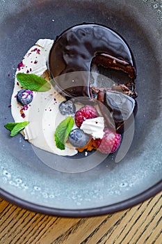 Chocolate fudge mousse cake with ice cream,berries