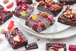 Chocolate fudge pieces with pecan nuts, dried berries and chewy sweets