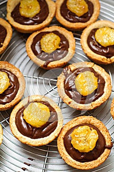 Chocolate ganache and banana tarts photo