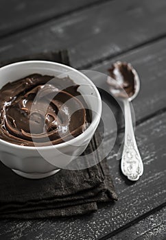 Chocolate ganache in a white bowl