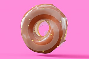 Chocolate glazed donut with sprinkles on a pink background
