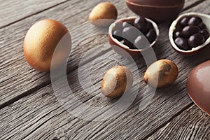 Chocolate easter eggs on wooden background