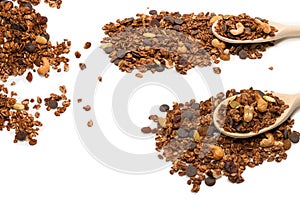 Chocolate granola cereal with nuts in a wooden spoon