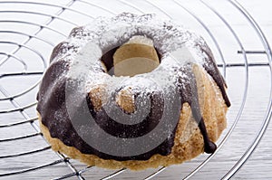Chocolate gugelhupf on a baking rack