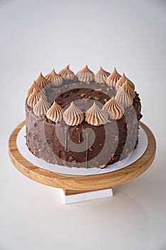Chocolate and hazelnut cake on white background