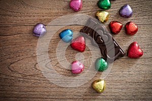 Chocolate heart with I love you on wooden table.