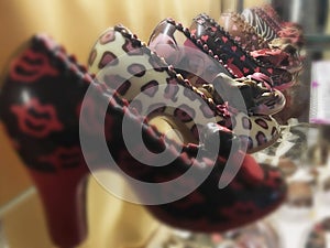 Chocolate high-heeled shoes in shop window