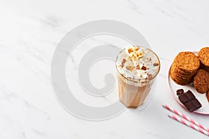 Chocolate ice coffee with whipped cream and cookies