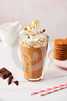 Chocolate ice coffee with whipped cream and cookies