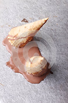 Chocolate ice cream cones dropped melt on ground