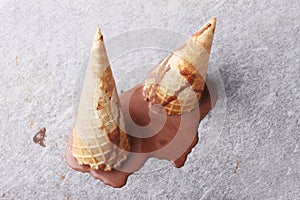 Chocolate ice cream cones dropped melt on ground