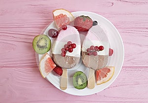 Chocolate ice cream, fruit, plate berries dairy snack fresh gastronomy on a pink wooden