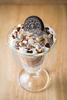 Chocolate ice-cream sundae with biscuit on top for decor