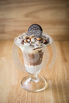 chocolate ice-cream sundae with biscuit on top for decor photo