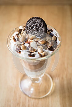Chocolate ice-cream sundae with biscuit on top for decor photo