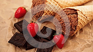 Chocolate ice cream in a waffle cone on craft paper background