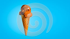 Chocolate Ice Cream in a Waffle Cone Isolated on a Blue Background