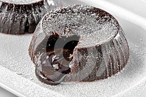 Chocolate lava brownie cakes close-up  on white plate