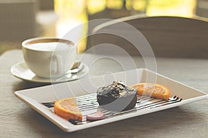 Chocolate lava cake with fresh fruit and coffee