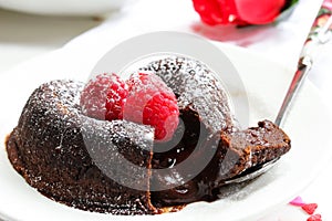 Chocolate Lava Cake Heart shaped with raspberry photo