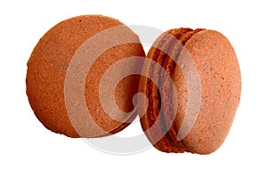Chocolate macaron isolated on white background without a shadow closeup. Top view. Flat lay