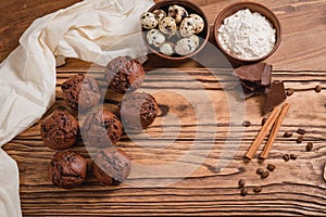 Chocolate mafin on a wooden background