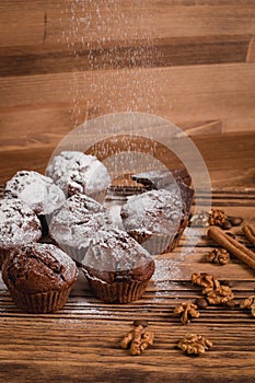 Chocolate mafin on a wooden background