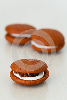 Chocolate marron cookies with nuts cream photo