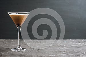 Chocolate martini with spices on the rustic background