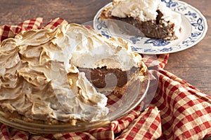 A Chocolate Meringue Pie on a Rustic Wooden Table