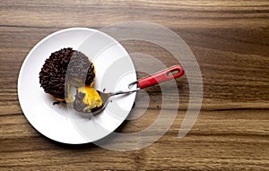 Chocolate Meses Doughnut with Spoon on white plate photo