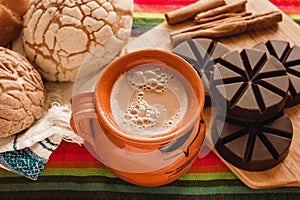 Chocolate mexicano and conchas, cup of mexican chocolate from oaxaca mexico photo