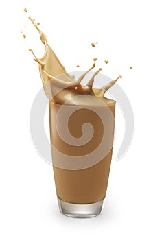 Chocolate milk or milk tea splashing out of glass isolated on white with clipping path