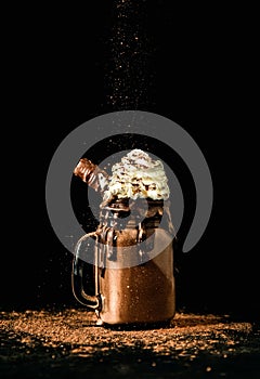 Chocolate milkshake with cream and chocolate biscuit