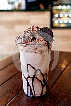 Chocolate milkshake with cream and oreo biscuits