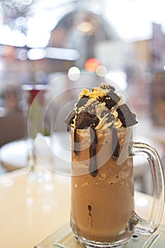 Chocolate milkshake with ice cream and whipped cream then topped with brownie and Chocolate sauce, served in Mason Jars