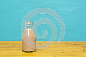 Chocolate milkshake in a one-third pint glass milk bottle