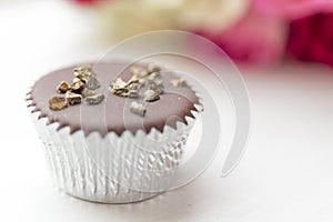 Chocolate mini cupcake with gold sprinkles
