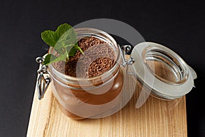 Chocolate mousse with mint in a glass jar