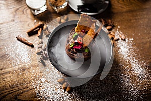 Chocolate mousse served with liquid ice smoke