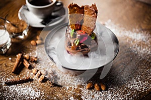 Chocolate mousse served with liquid ice smoke