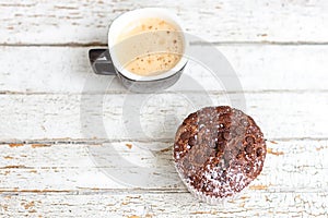 Chocolate muffin and cup of coffee
