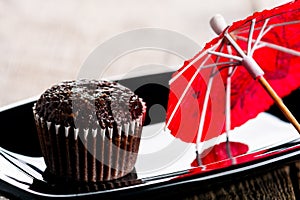 Chocolate muffin and red umbrella