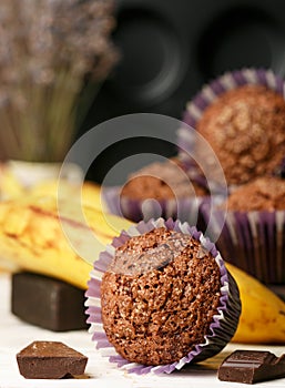 Chocolate muffins with banana and sugar crust