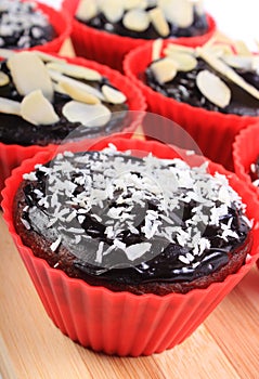 Chocolate muffins with desiccated coconut and sliced almonds